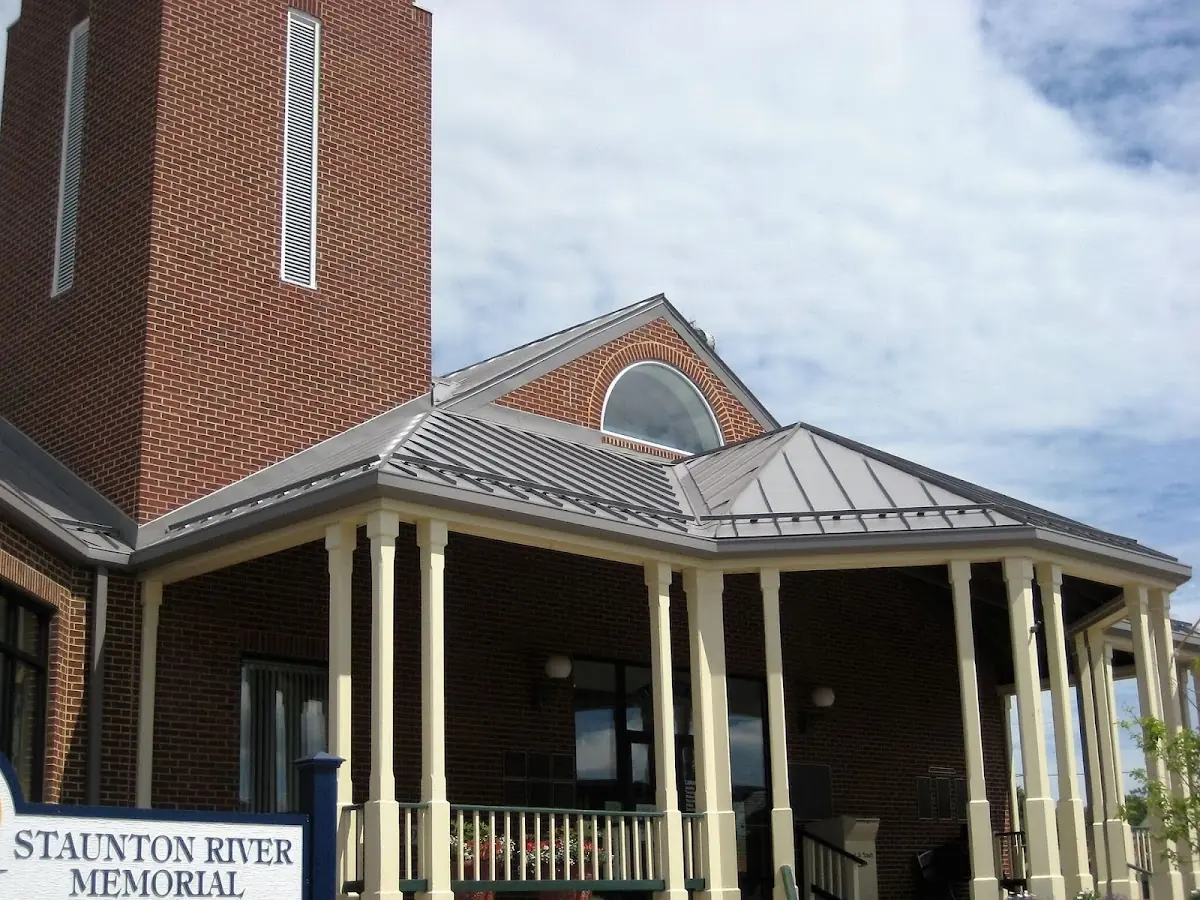 Skilled roofing craftsmen working on a residential roof in Bay Shore